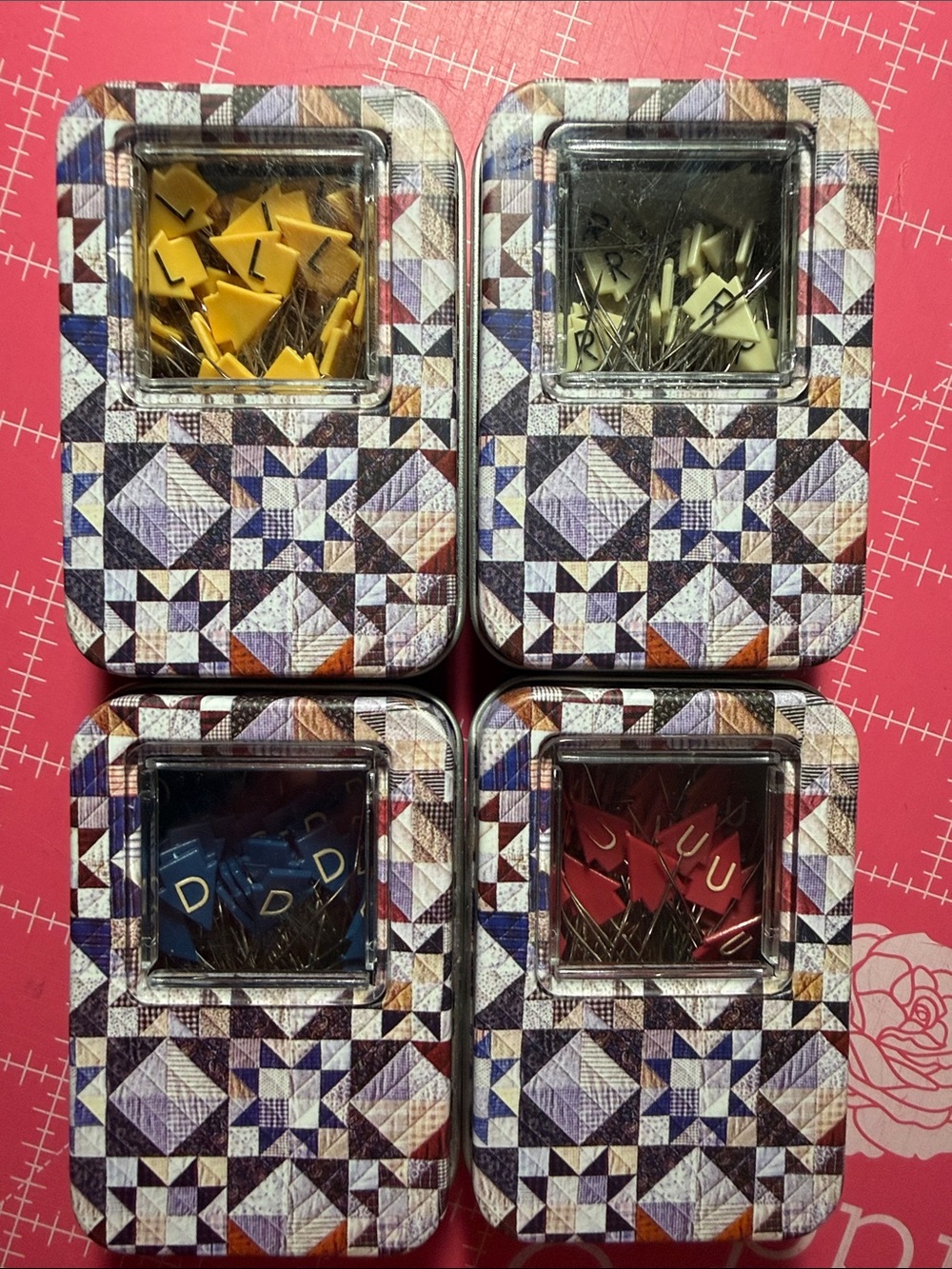 Quilters directional pins in collectors decorative tins.